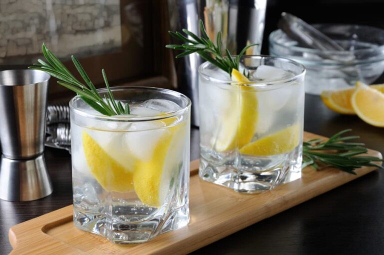 Two mocktails sitting on a bar